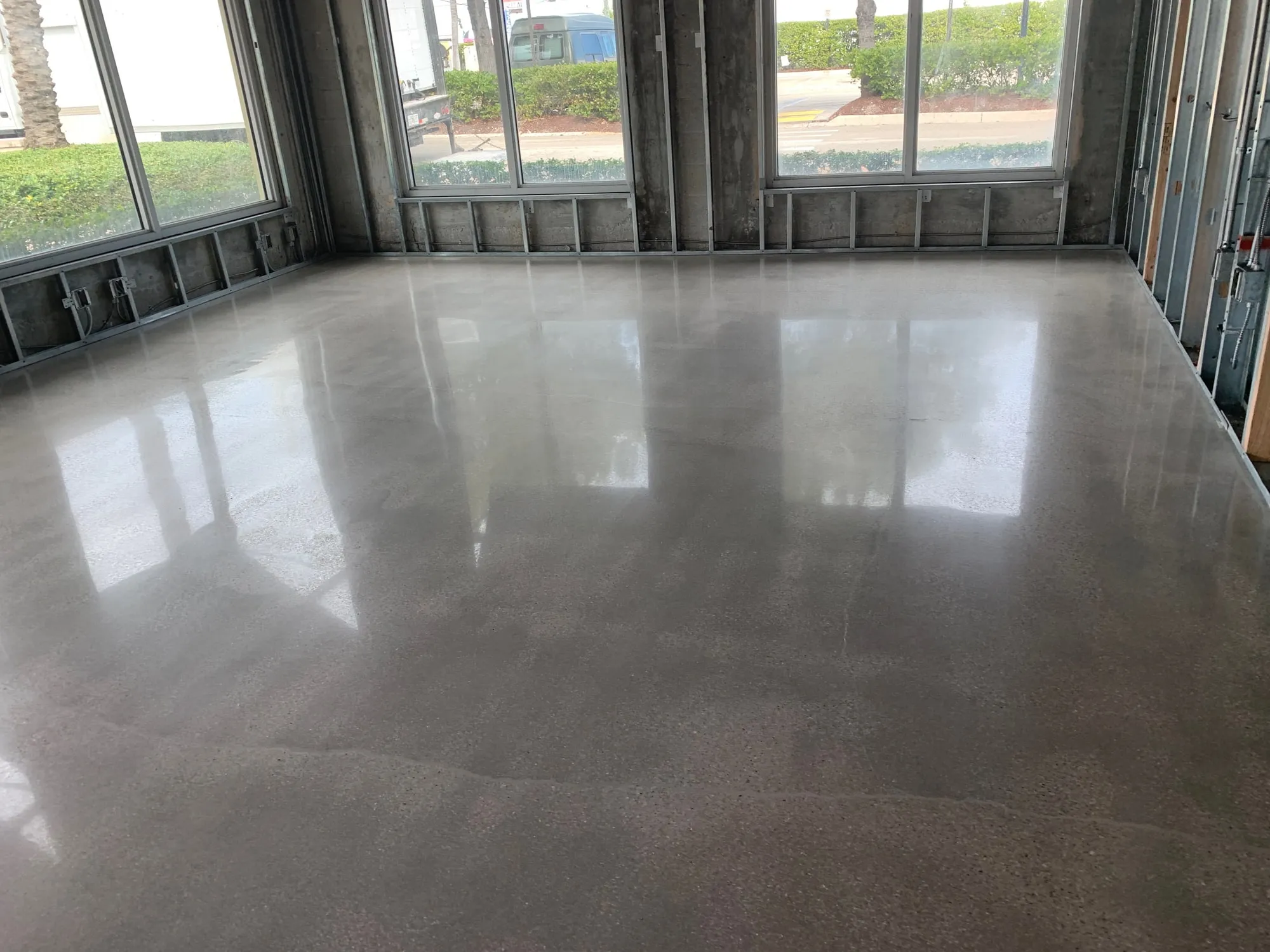 Polished concrete flooring and storefront glazing in a retail buildout