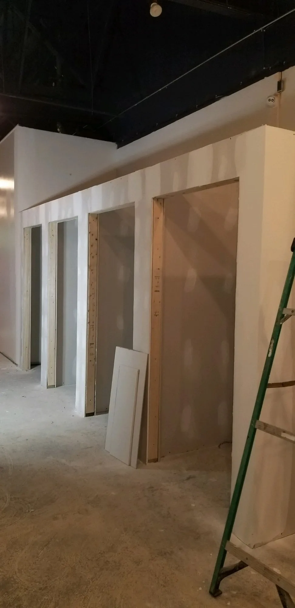 Retail service counter framed and wrapped in white shiplap