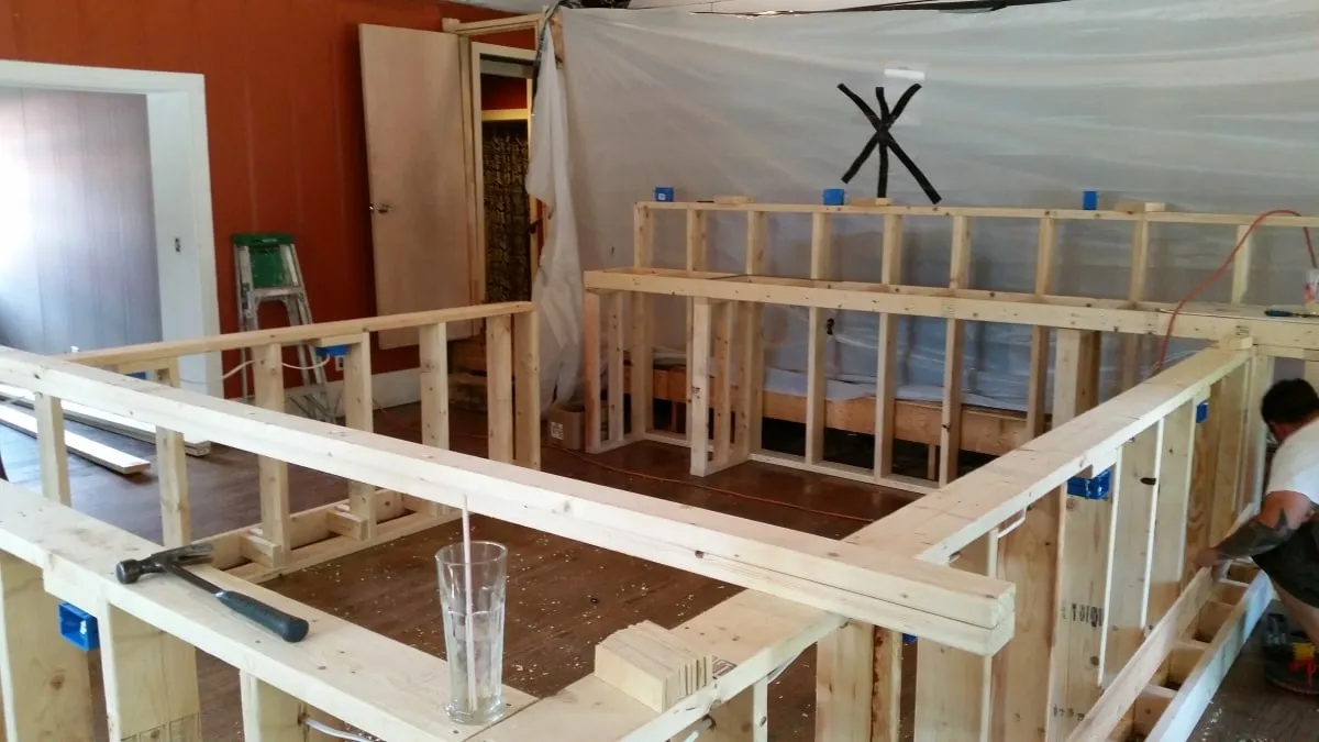 Bar framing under construction inside a restaurant renovation