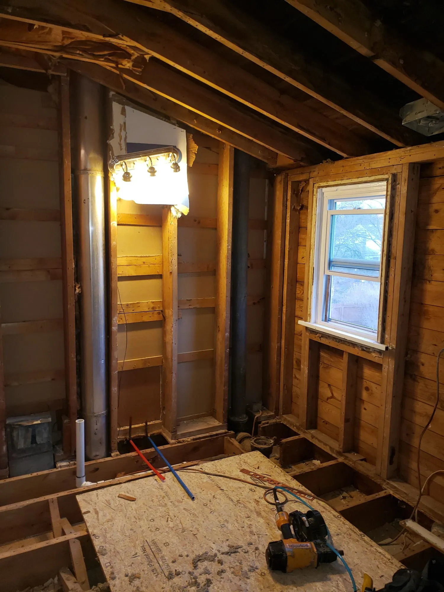 Bathroom walls opened up with new rough plumbing installed